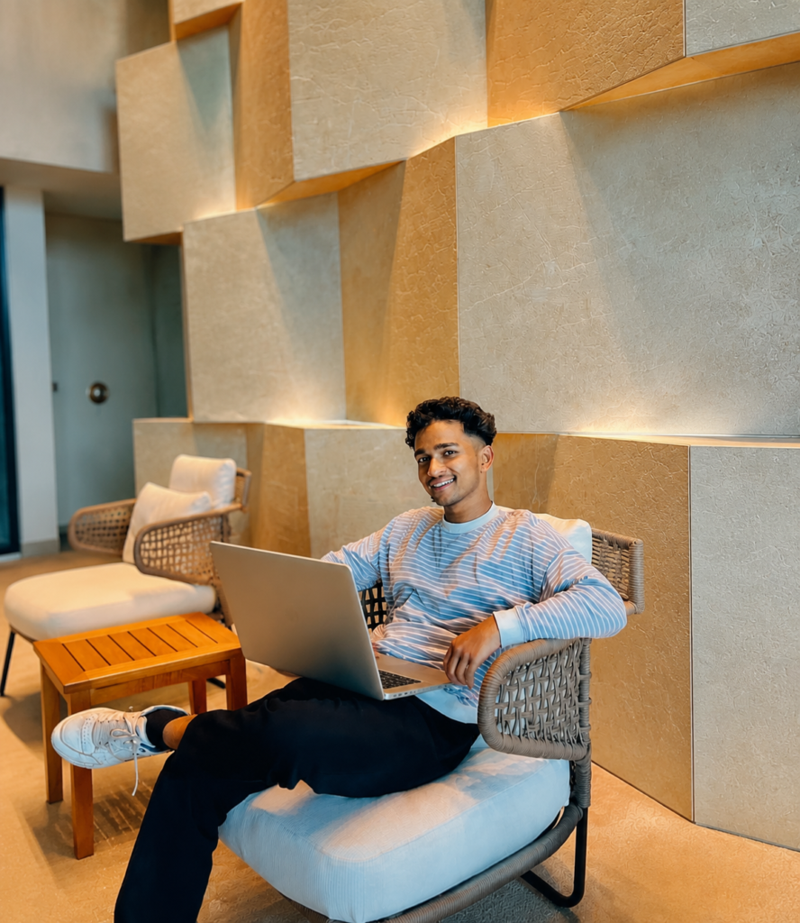 Best Digital Marketing Strategist in Kerala working on a laptop in a modern office